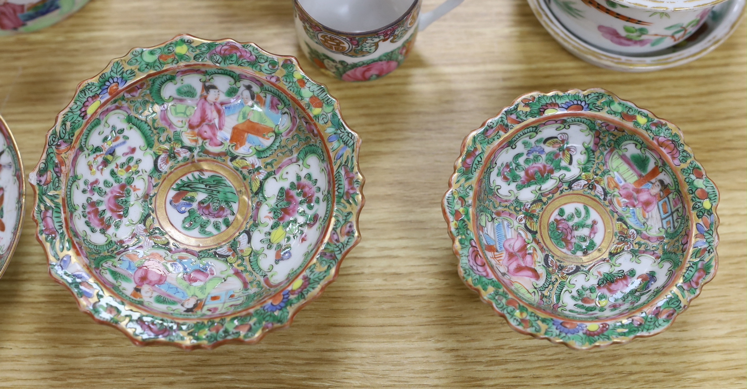 A quantity of 19th century Chinese famille rose dishes, plates, teapots and vases, tallest 21.5cm